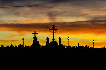 Wall Mural - Silhouettes of Charles Bridge (Karluv Most) statues during yellow sunset