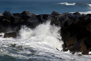 Sticker - Wave hitting the rocks in the shore in San Sebastian