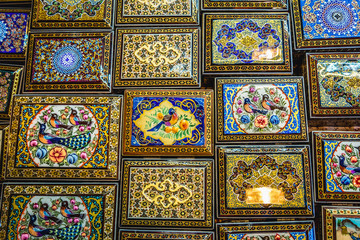 Sticker - Decorated wooden boxes for sale on the Grand Bazaar also called Qeysarriyeh or Soltani bazaar in Isfahan city, Iran