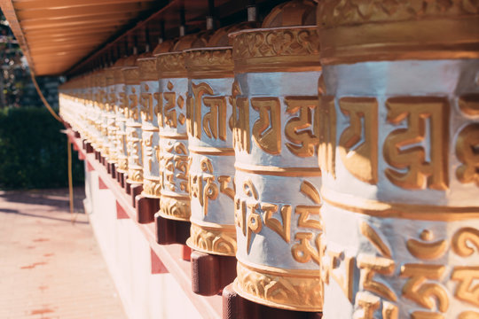 Golden prayer wheels typical of Buddhist temples.