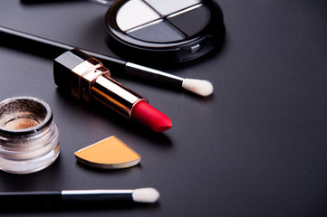 cosmetic products on a black background