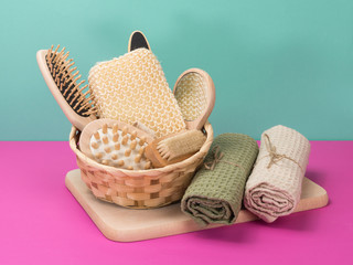 A bathing kit from eco-friendly materials on pink and turquoise background.