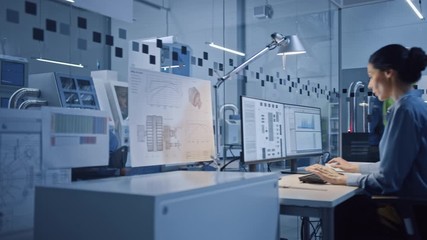 Leinwandbilder - In Factory: Professionals Working on CNC Machinery, Walk Through Workshop, Use Digital Tablet, Manipulate Robot Arm Production Line. In-Office: Engineer Controls System with Computer. Moving Camera