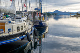 Fototapeta  - Vintage sailing boats dockes at Kyle of Lochalsh. Beautiful calm evening at Hebrides, Scotland.