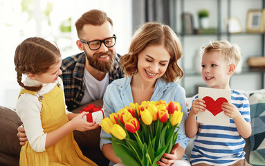 Sticker - happy mother's day! father and children congratulate mother on holiday  .