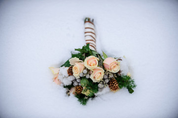 Wall Mural - Delicate bouquet of pink and white flowers in the snow. Unusual wedding stylish bouquet with pink and white flowers, wedding dress, details