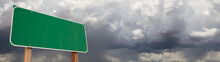 Blank Green Road Sign Against Ominous Cloudy Stormy Sky Background Banner