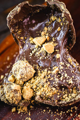 details of chocolate with peanuts, Brazilian and homemade Easter egg, focal point in macro image.