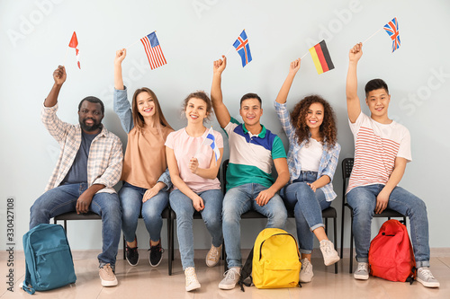 Fotomural Young students of language school near color wall