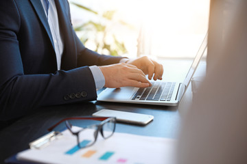 Businessman working on laptop in office