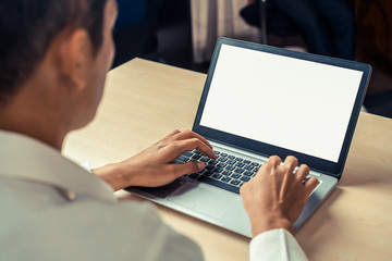 Wall Mural - Business person or office worker using laptop computer while sitting at desk.