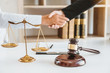 © joyfotoliakid - Businessman shaking hands to seal a deal Judges male lawyers Consultation legal services Consulting in regard to the various contracts to plan the case in court.