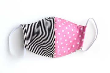 black and pink design of face mask handmade from fashion fabric cloth isolated on white background