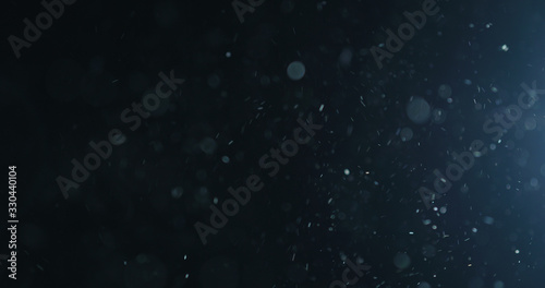 Fotografía natural dust particles flow in air on black background