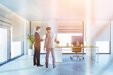 Canvas Print - Two businessmen in panoramic white CEO office