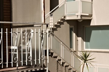 Wall Mural - An isolated white plastic chair in the balcony (Pesaro, Italy, Europe)