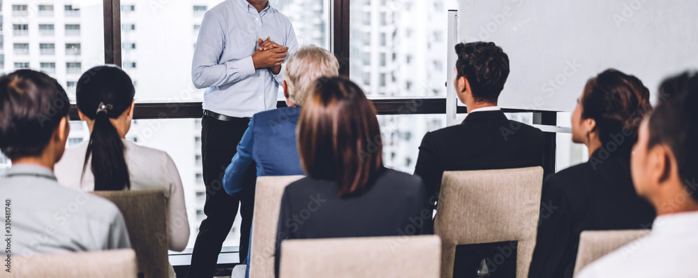 Businessman standing in front of group of people in consulting meeting conference seminar at hall or seminar room.presentation and coaching concept - obrazy, fototapety, plakaty 