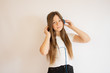 © Danko - Girl with long hair listening to music