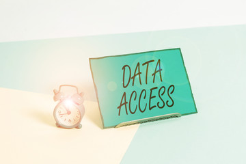 Fototapete - Conceptual hand writing showing Data Access. Concept meaning a user s is ability to access data stored within a database Alarm clock beside a Paper sheet placed on pastel backdrop