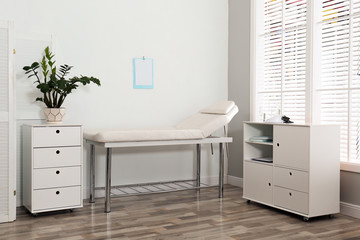 Sticker - Modern medical office interior with examination table