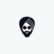 silhouette of a male head with a beard in a Sikh turban and glasses