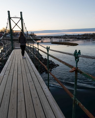 Wall Mural - Sunrise on Wiggly Bridge in York Harbor with solo female - York, Maine.