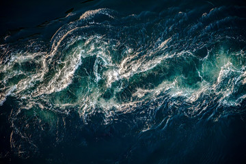 Wall Mural - Waves of water of the river and the sea meet each other during high tide and low tide