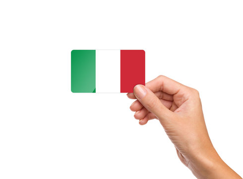 Beautiful hand holding Italy flag card on white background