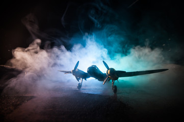 Wall Mural - German Junker (Ju-88) night bomber at night. Artwork decoration with scale model of jet-propelled plane in possession.