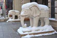 Beautiful Statue Of A White Elephant Covered With Fluffy Snow.