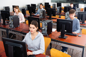 Wall Mural - Teacher conducts computer science exam in university class