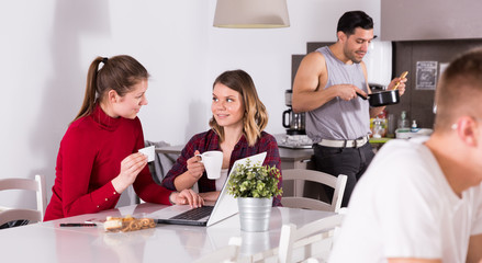 Poster - Two girls at kitchen of hostel