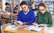 © JackF - Portrait of couple of adult students studying together in public library