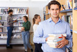 © JackF - Man standing in library