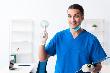 Young male doctor working in the clinic