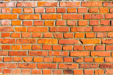 Old school texture - a retro wall built of red brick.