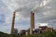 Coal-fired Power Plant with smokestakes spewing steam