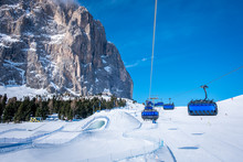 Blue ski chairlift in ski resort of Selva di Val Gardena, Italy