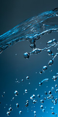 Wall Mural - abstract drop water splash on blue background