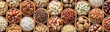 assorted nuts background, vegetarian food in wooden bowls, top view