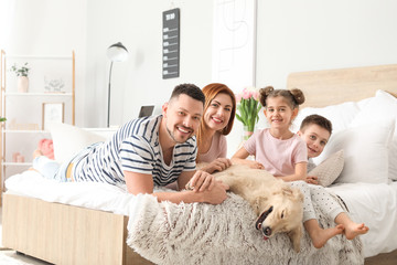Wall Mural - Happy family with dog in bedroom at home