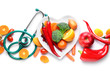 Plate with healthy products and stethoscope on white background