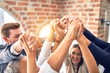 © Krakenimages.com - Group of business workers smiling happy. Standing with fists up at the office