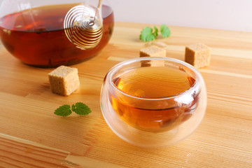 tea cup teapot wooden background