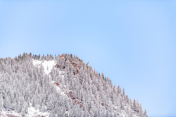 Wall Mural - Maroon Bells mountain peak red rocks at morning sunrise in Aspen, Colorado and trees forest view and winter snow blue sky
