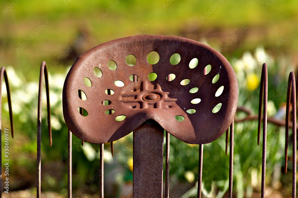 Perforated Rusted seat of old horse drawn hay rake, Red Barn Museum ...