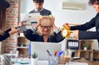 © Krakenimages.com - Group of business workers working together. Partners stressing one of them at the office