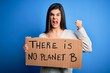 © Krakenimages.com - Young beautiful brunette activist woman holding banner protesting to care the planet annoyed and frustrated shouting with anger, crazy and yelling with raised hand, anger concept