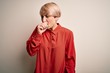 © Krakenimages.com - Young beautiful business blonde woman with short hair standing over isolated background feeling unwell and coughing as symptom for cold or bronchitis. Health care concept.