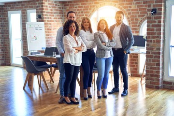 Canvas Print - Group of business workers smiling happy and confident. Posing together with smile on face looking at the camera at the office